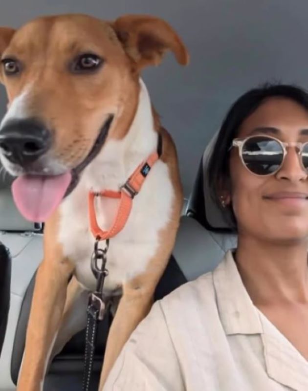 woman and pup in the car