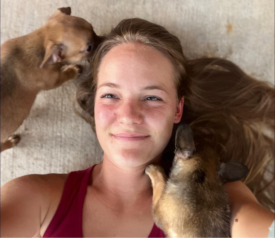 woman and two puppies