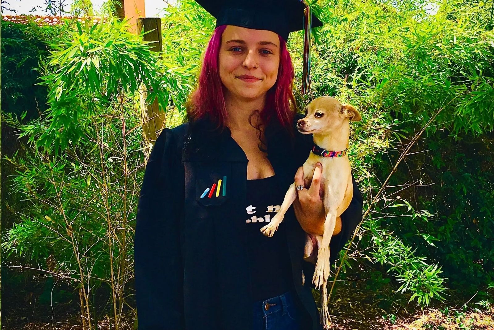 woman graduating and dog 
