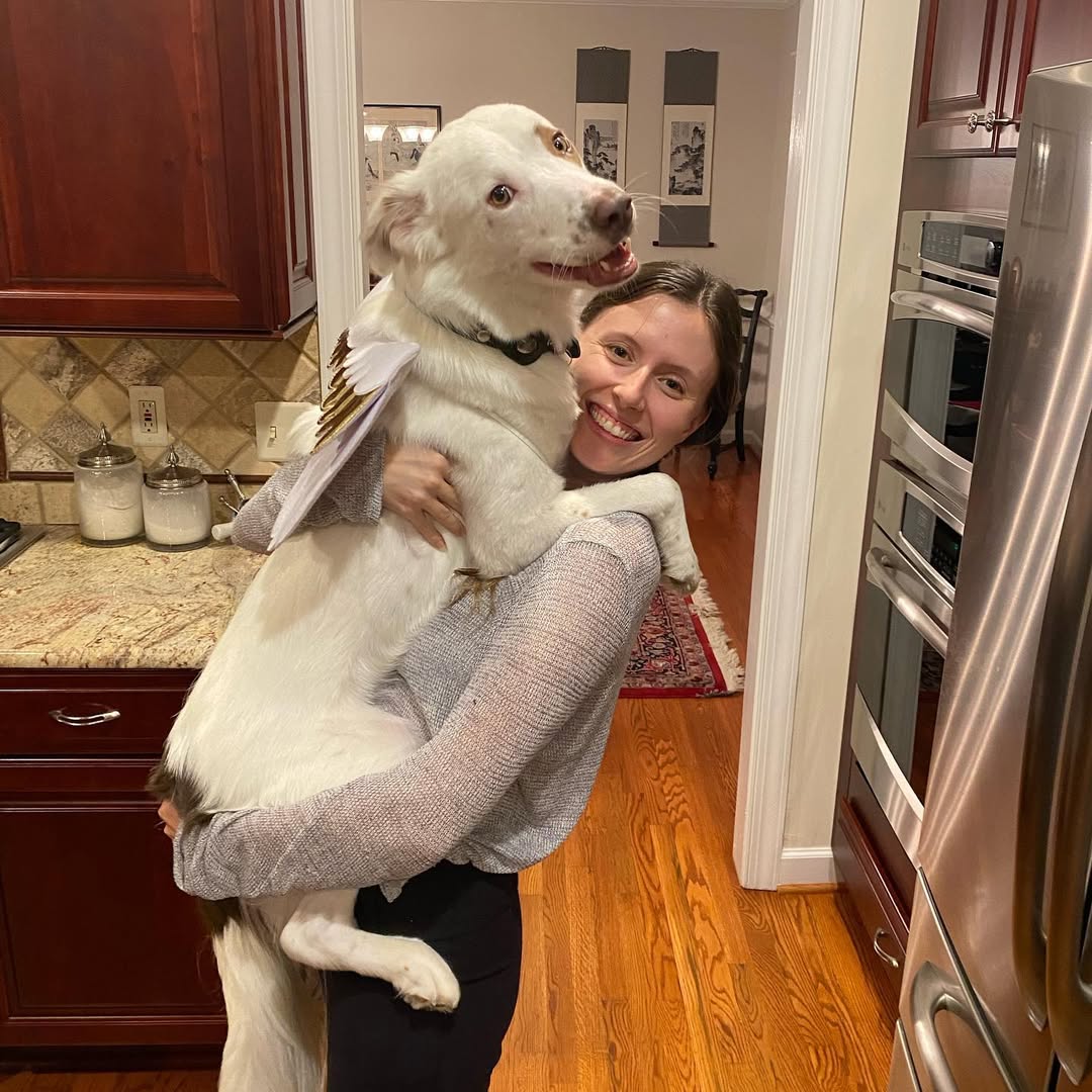 woman holding a dog 