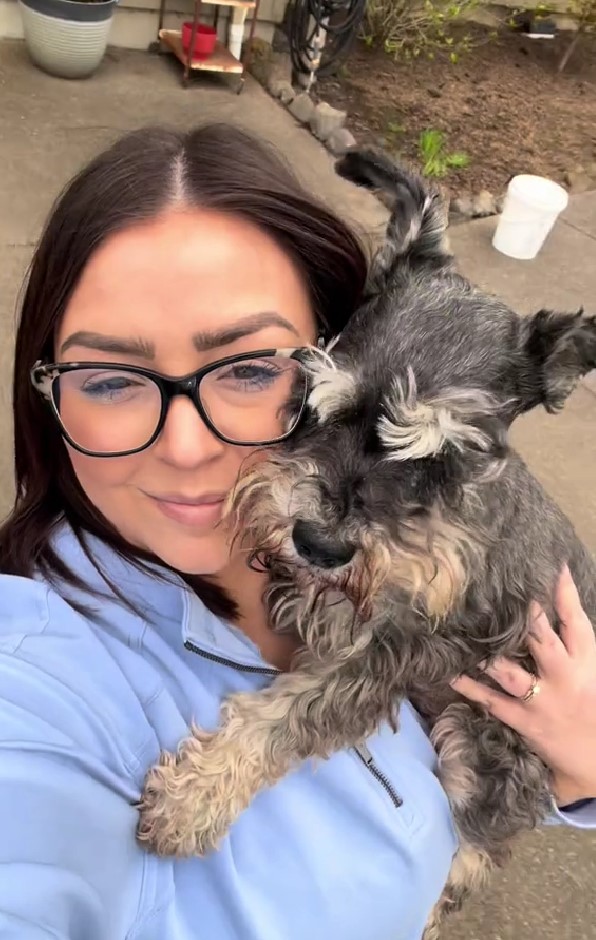 woman holding a dog