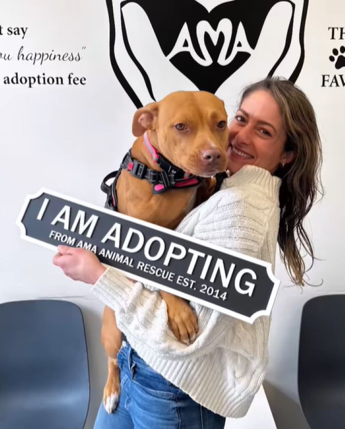 woman holding an adopted dog