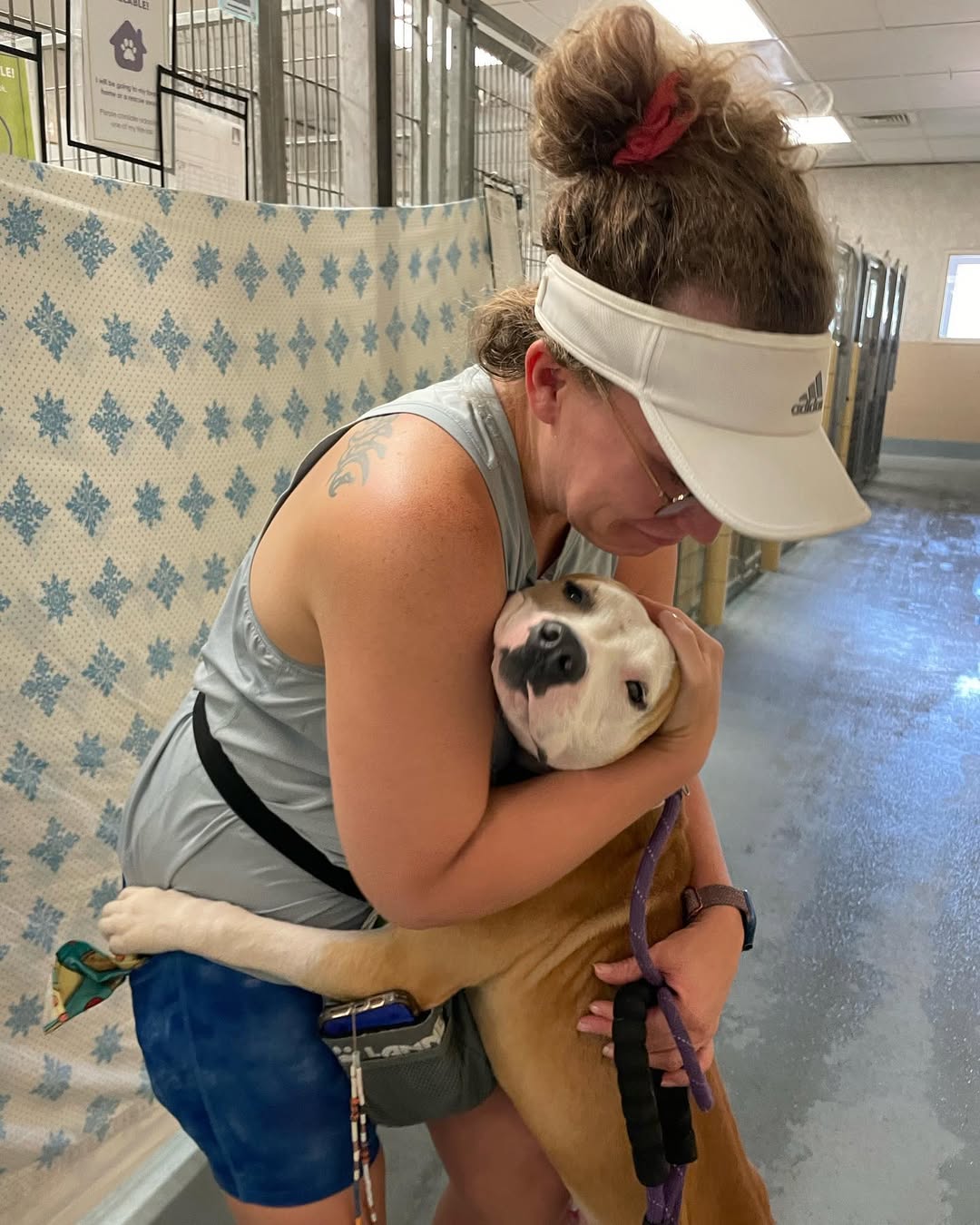 woman hugging a dog