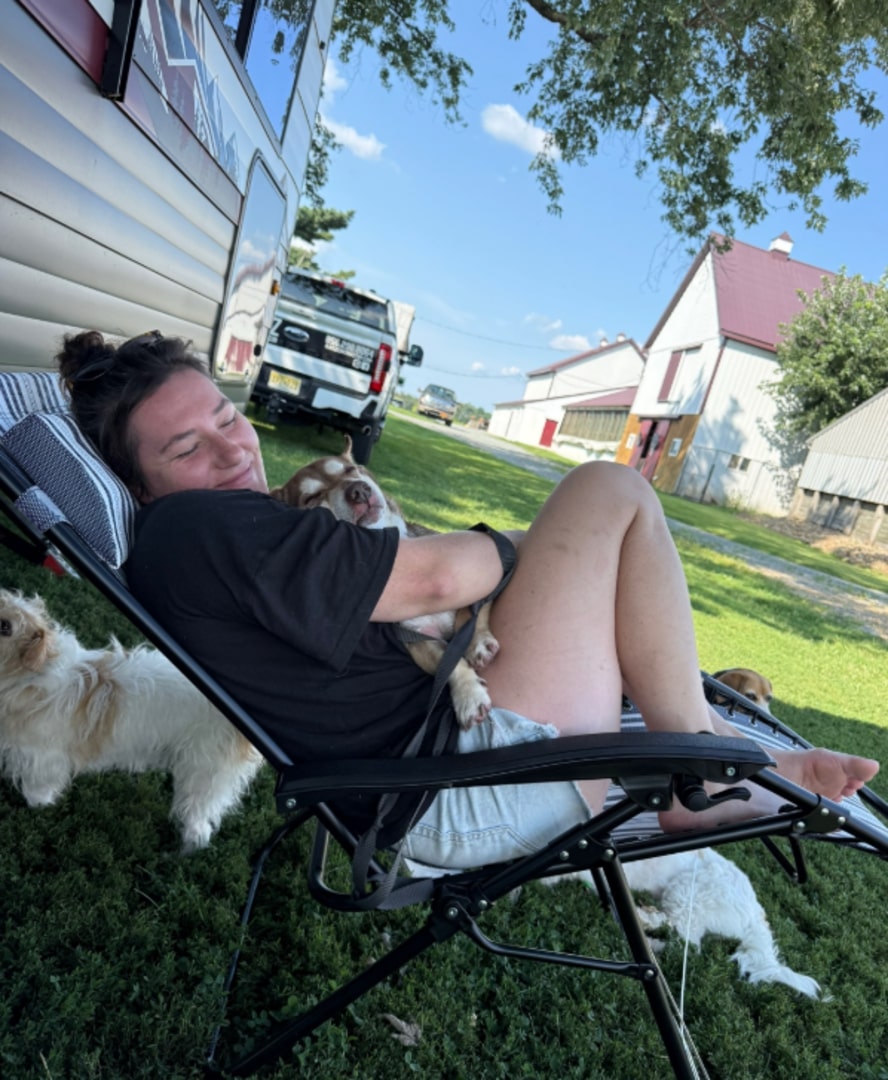 woman hugging a dog