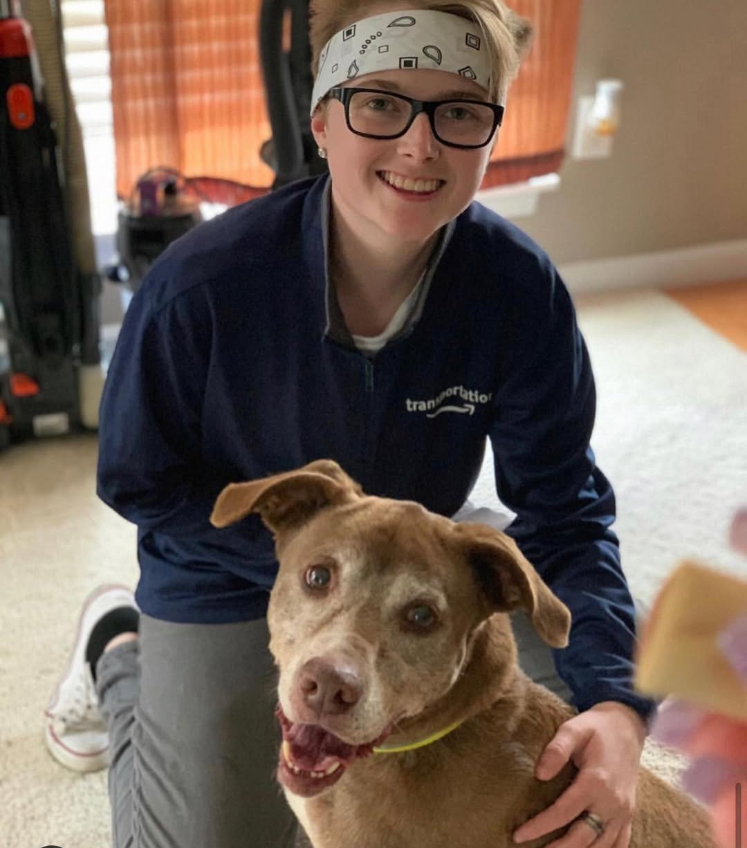 woman hugging a senior dog