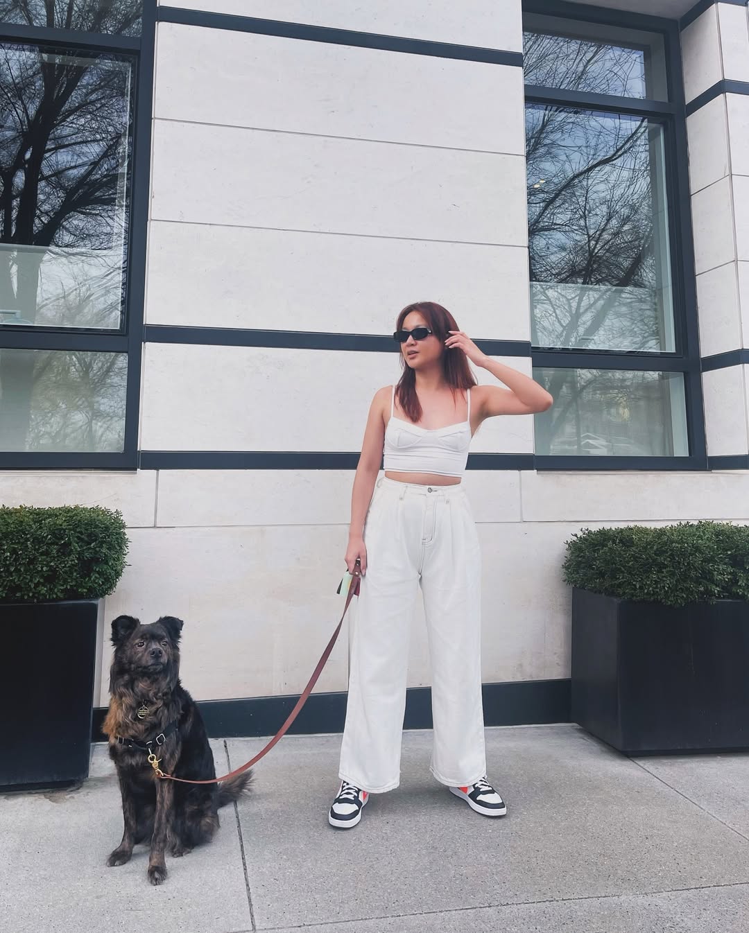 woman in white and dog