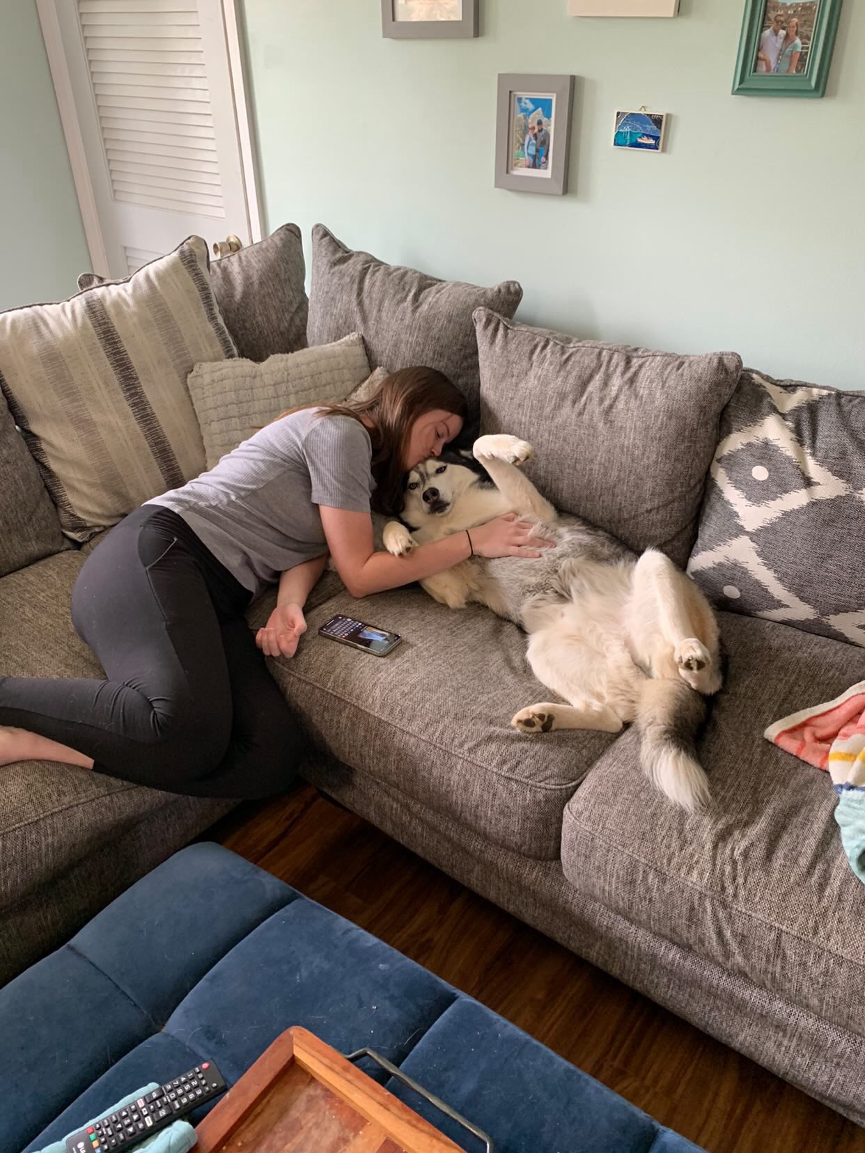 woman petting a husky