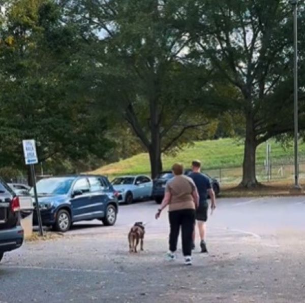 couple and adopted dog