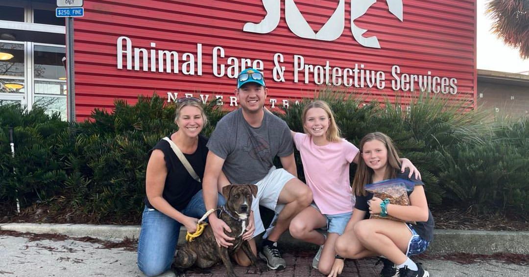 family and adopted dog