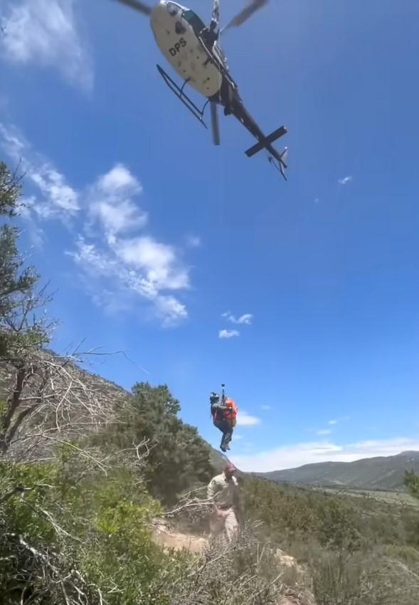 helicopter saving a woman