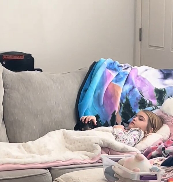 kid and dog laying down
