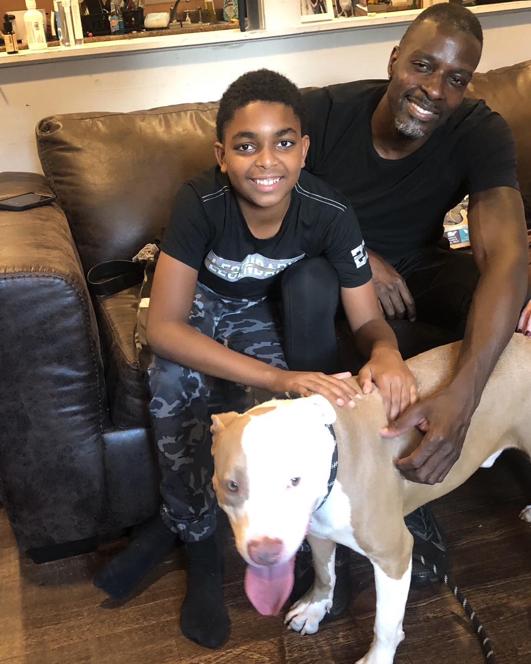 man and boy with a dog