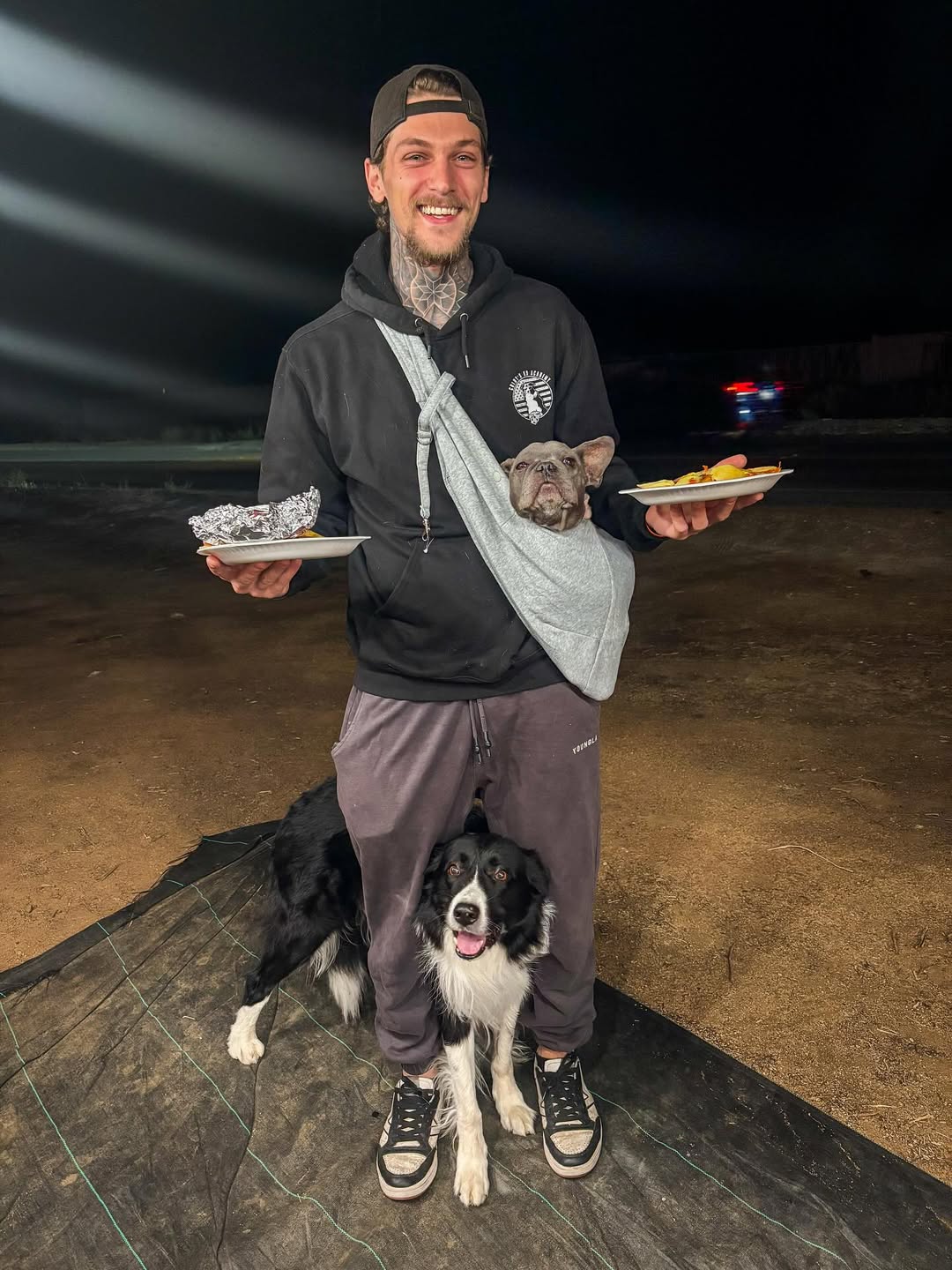 man and two dogs