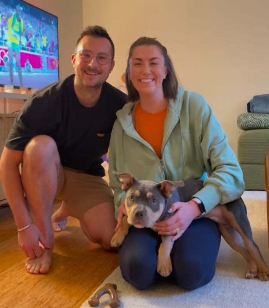 man and woman with the pup