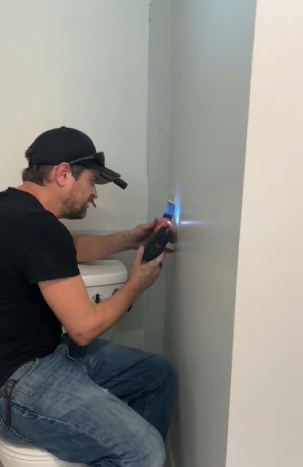 man breaking a wall