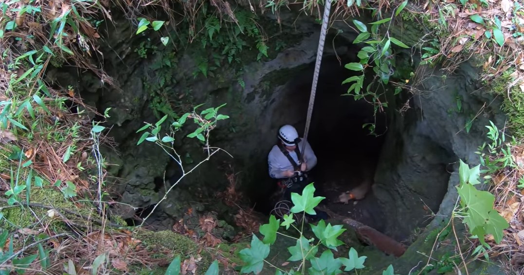 man going in cave