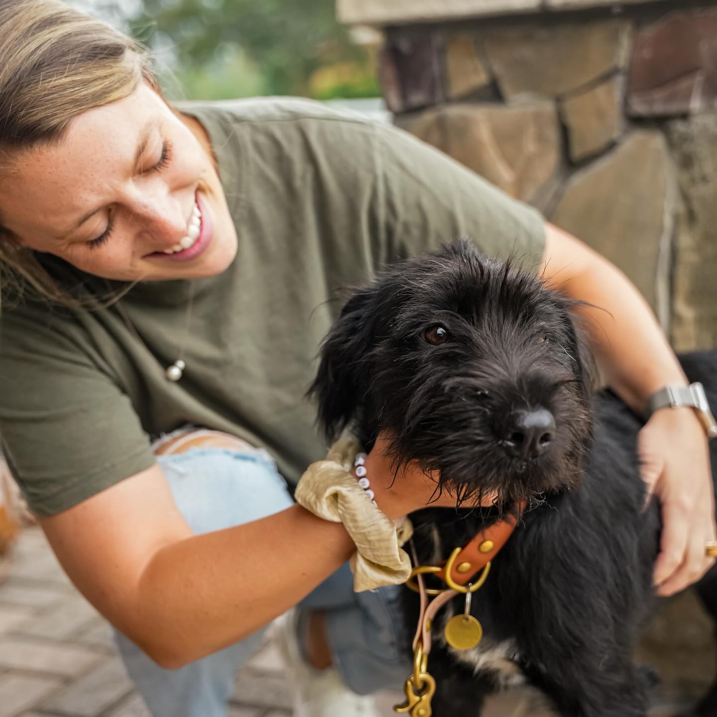 woman and black dog