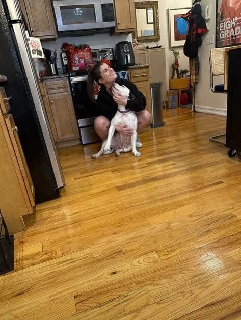 woman and dog in house