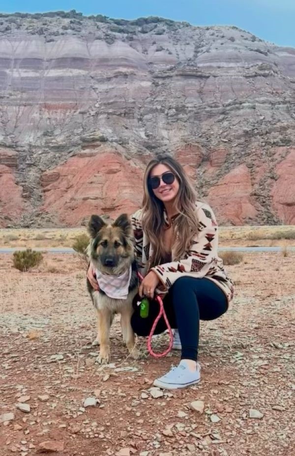 woman and dog posing for picture