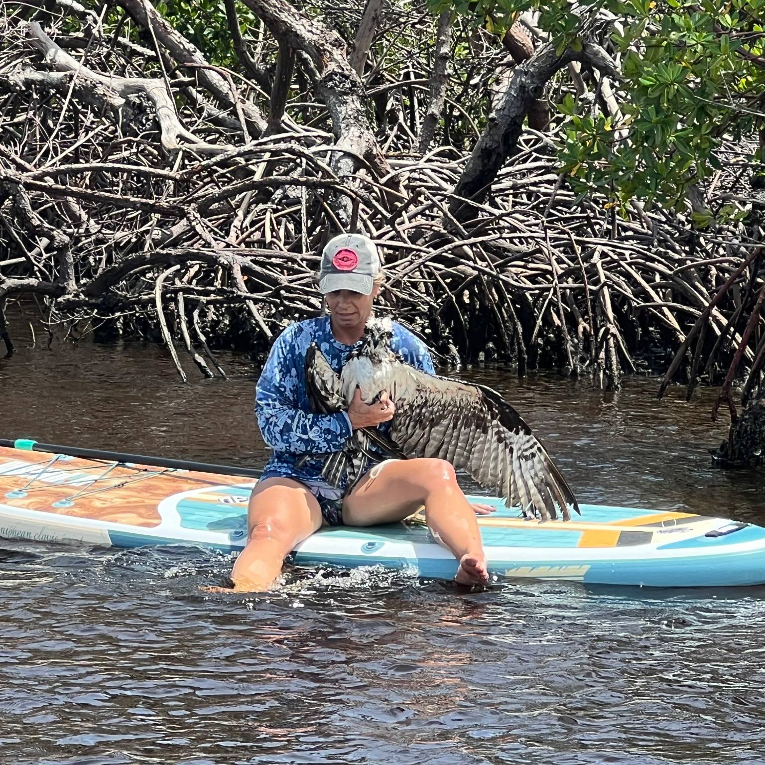 woman holding a bird