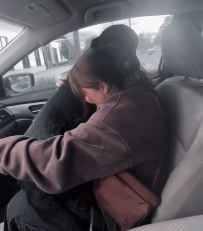 woman hugging an adopted dog