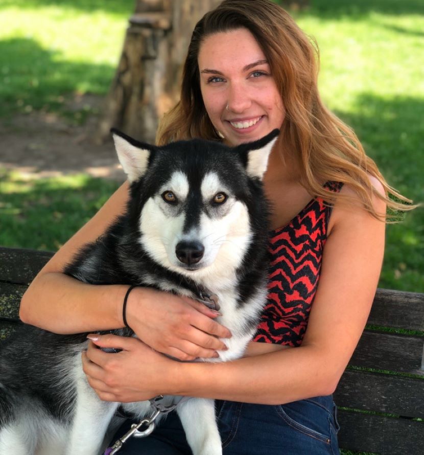 woman hugging her dog