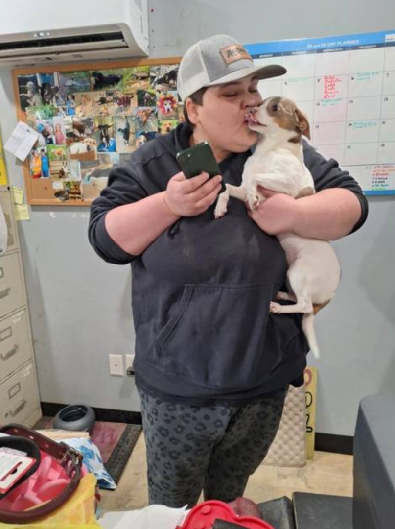 woman kissing the dog