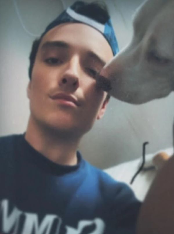 young man and dog