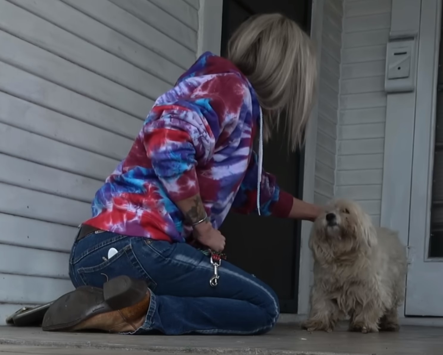 blonde woman and white dog on porch