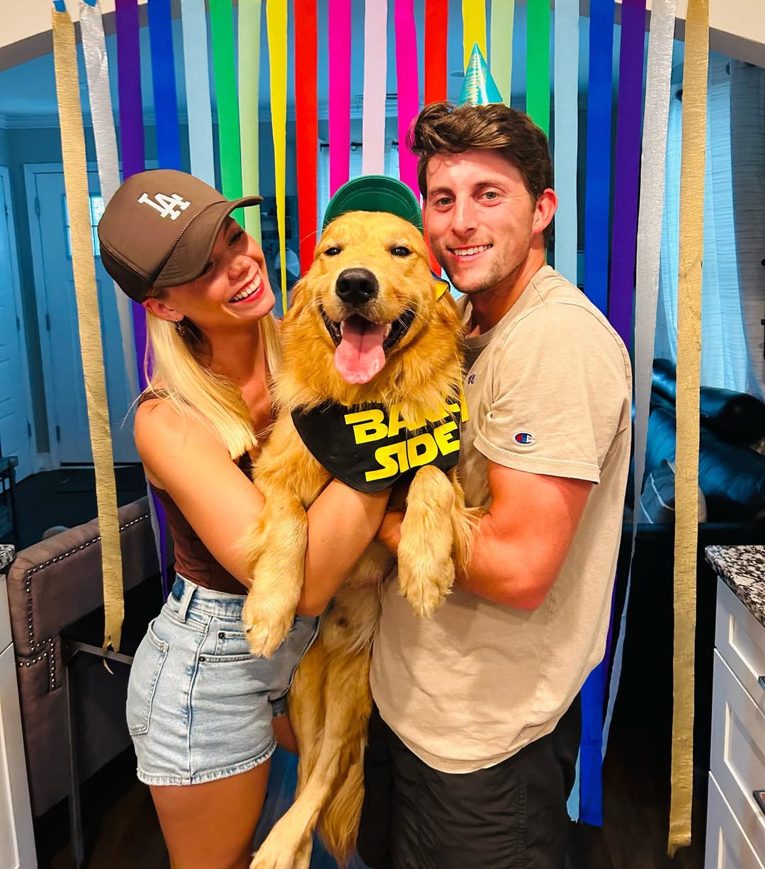 couple and Golden Retriever