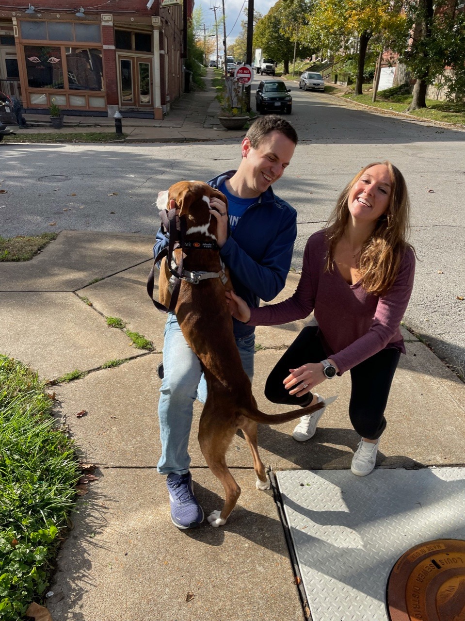 couple and senior dog