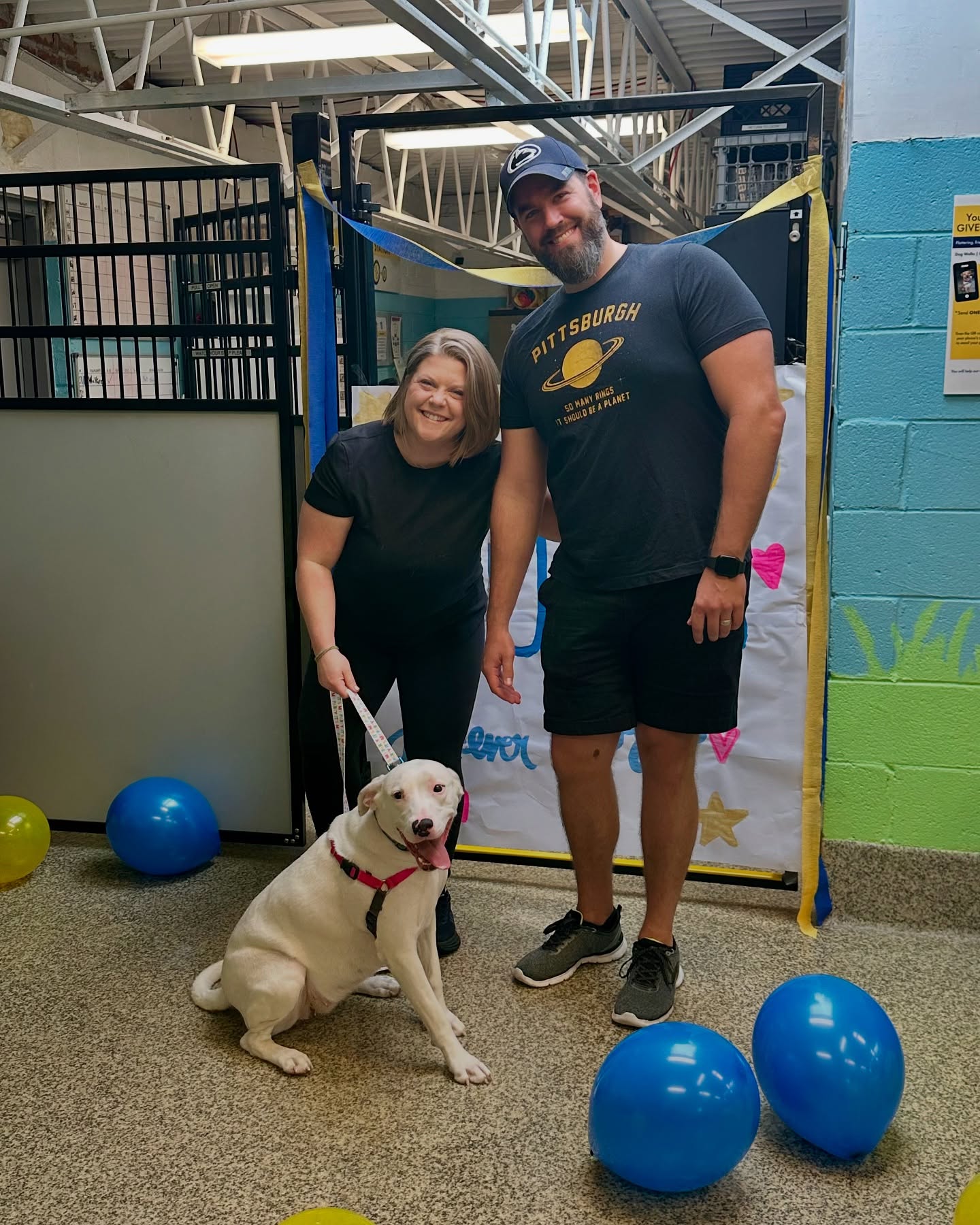 couple and white dog