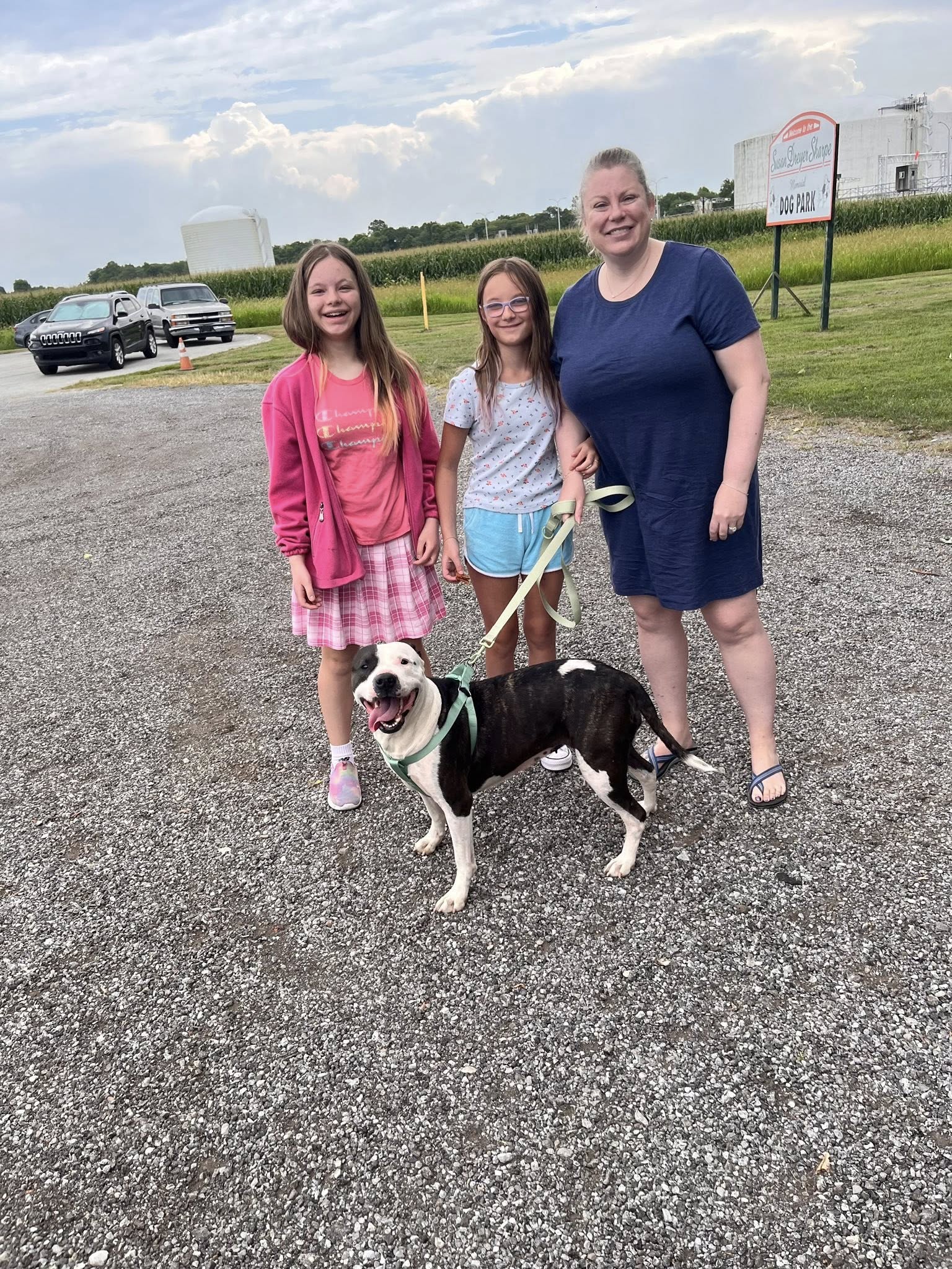 family and dog on leash