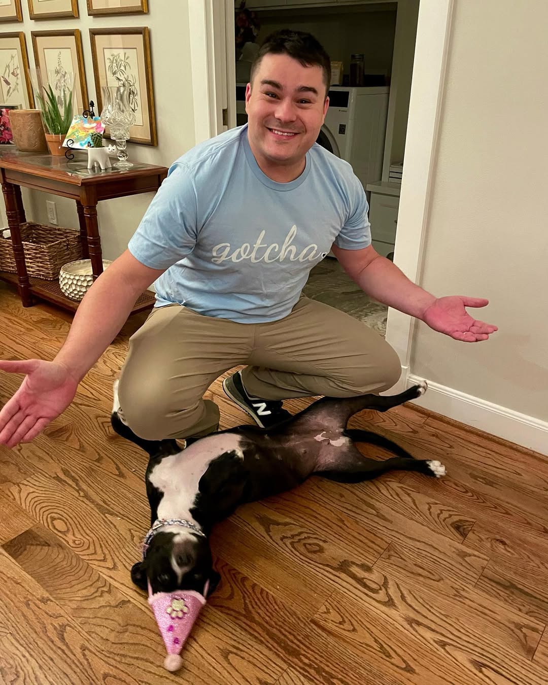 man and dog in house