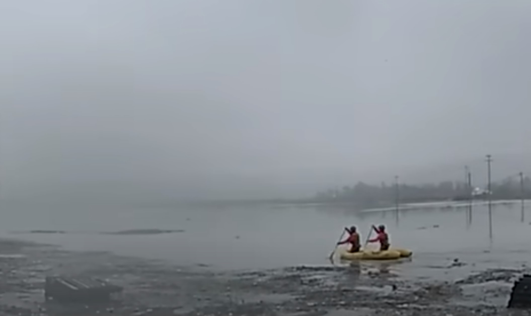 men rowing in water