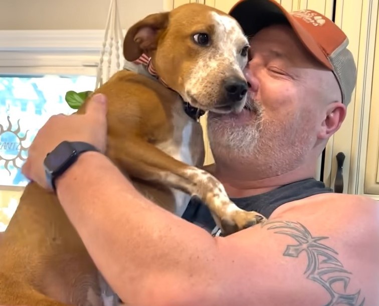 old man and brown dog