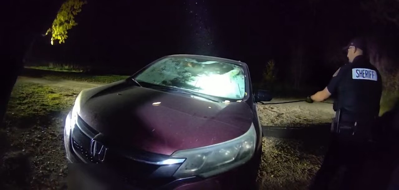 sheriff checking a car