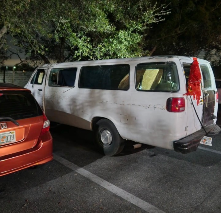 white van in the parking lot