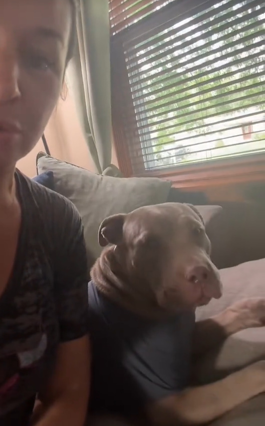 woman and dog in house