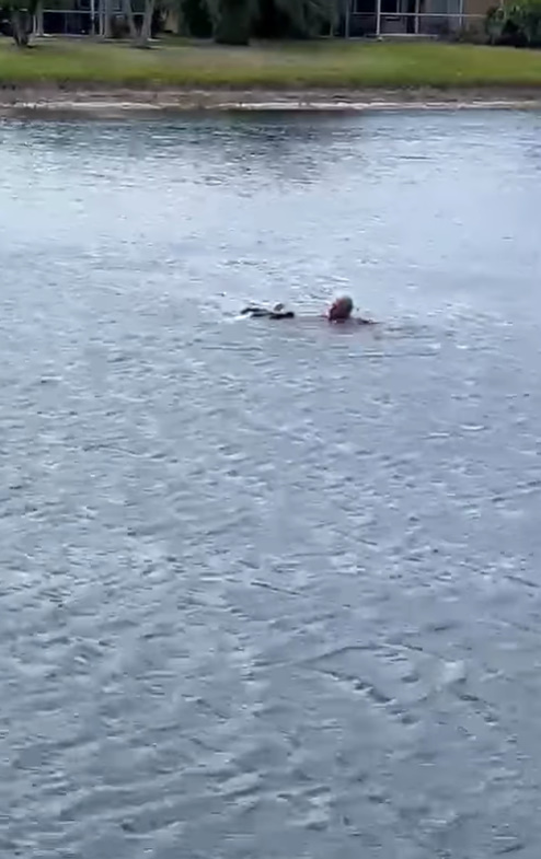 a man swimming in the lake