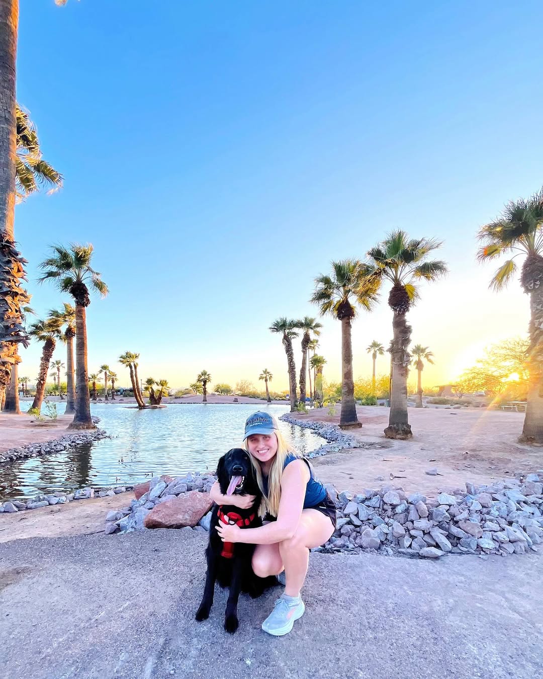 blonde woman hugging a dog