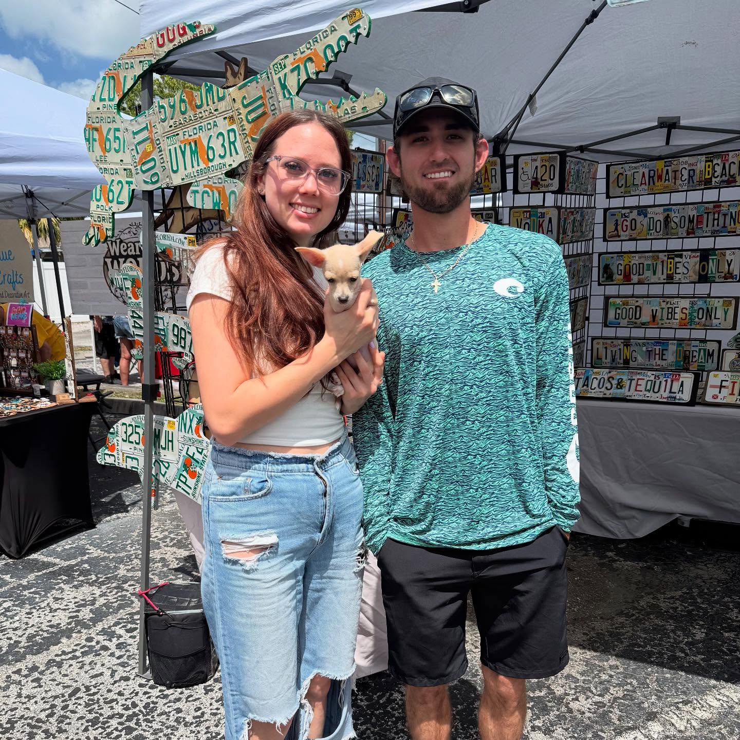 couple and newborn puppy