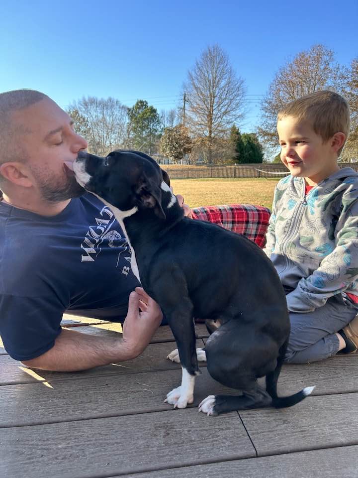 dad with kid and dog