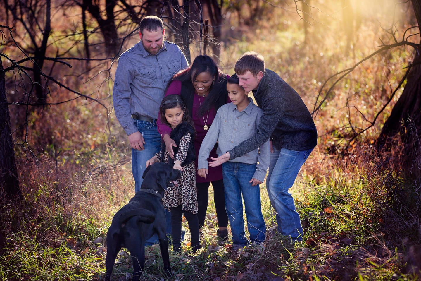 family and black dog