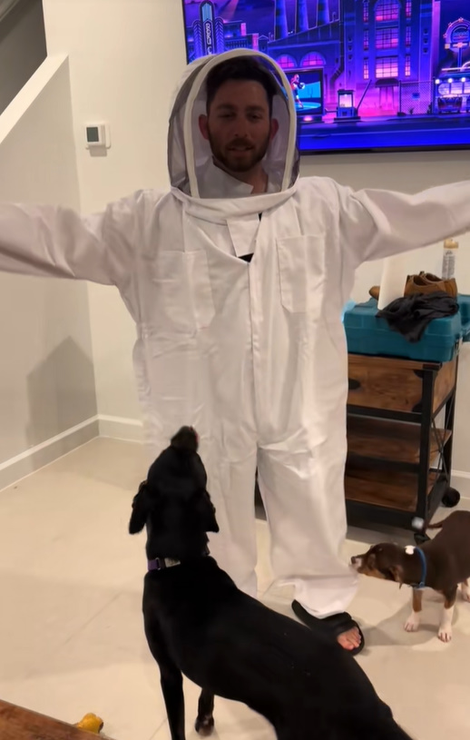 man and dog in house