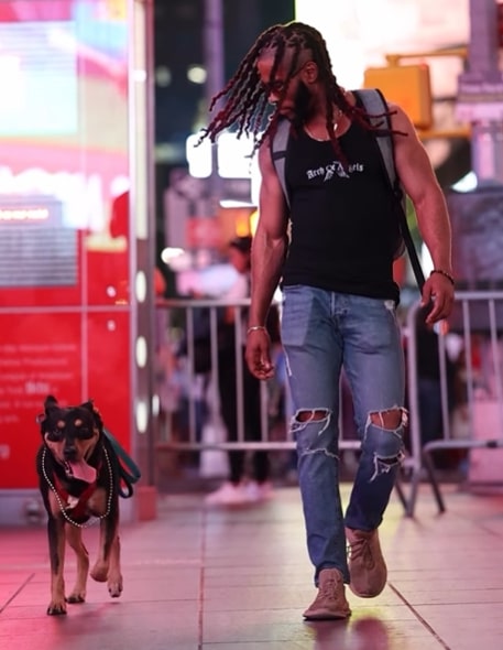 man and dog walking together