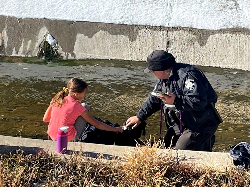 man and kid saving a dog