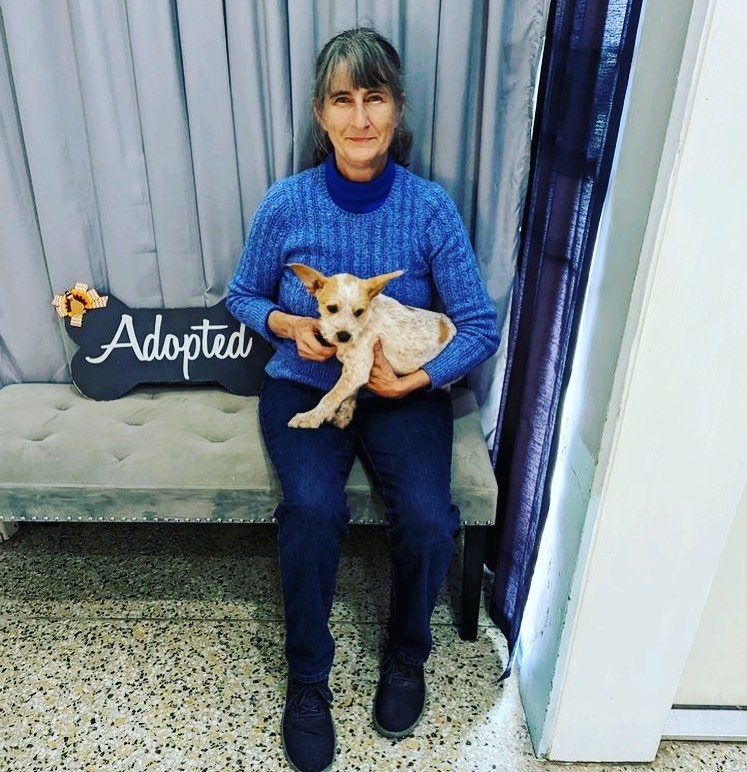 old woman with puppy