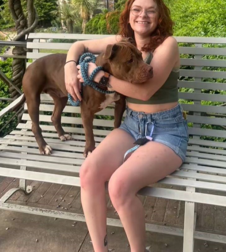 woman and dog on bench