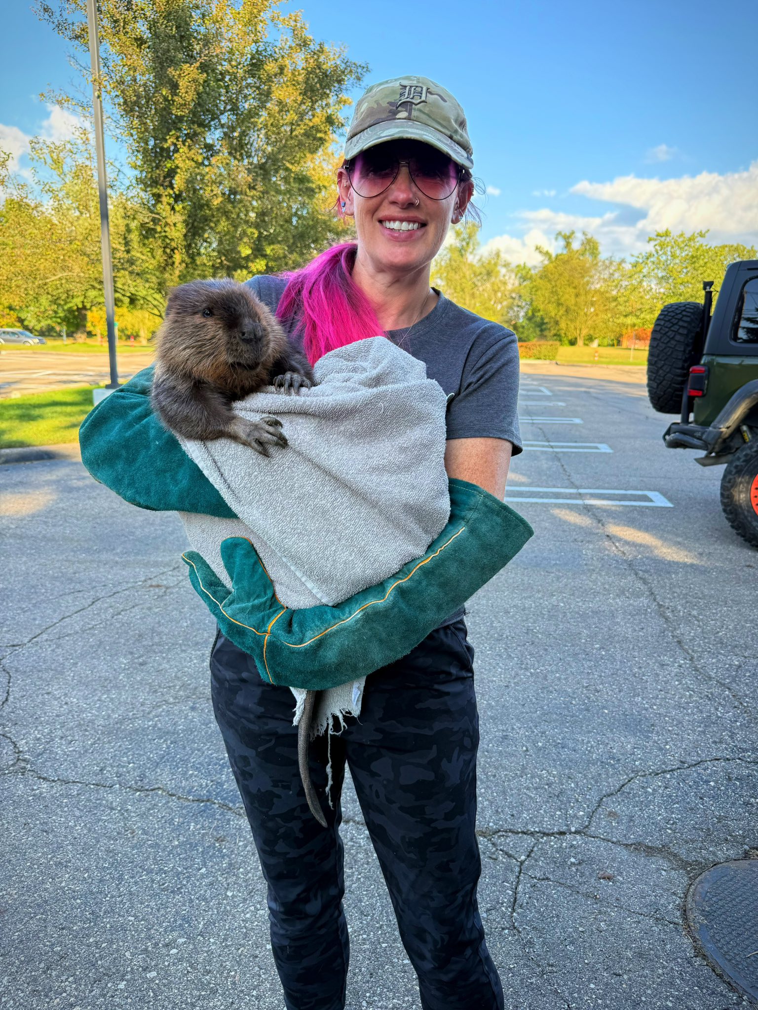 woman holding a beaver